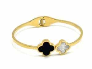 Gold clover bracelet for women with black and pearl clover design on adjustable gold bangle