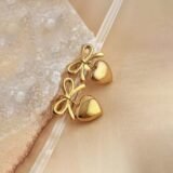 Gold bow heart earrings for women with elegant bow design and polished heart drop