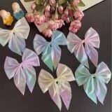 Pack of 3 baby hair bow clips in soft pastel colors for infants and toddler girls